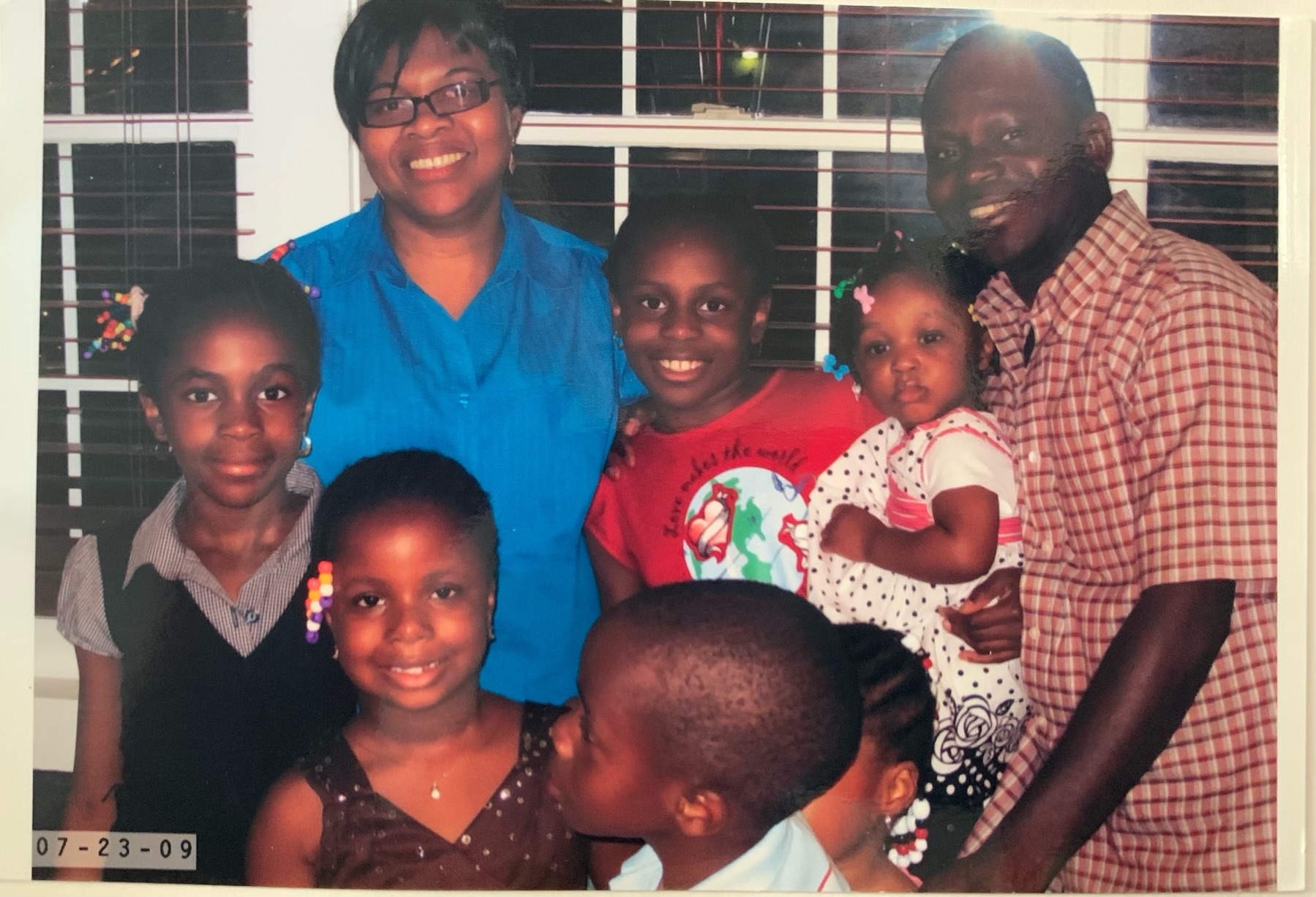 Hope Egie (left) smiles in a family photo with her mother Isimeme Akoko (upper left)