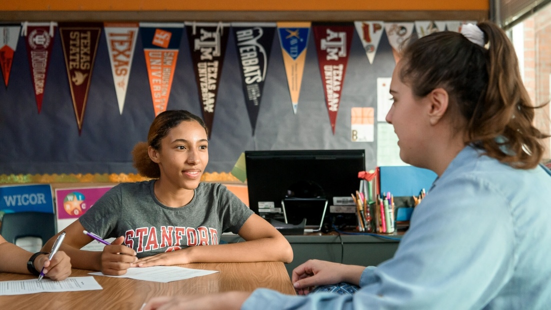 Student receives college guidance from counselor