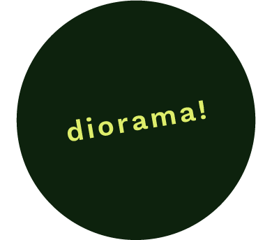 a circular sticker that says diorama!