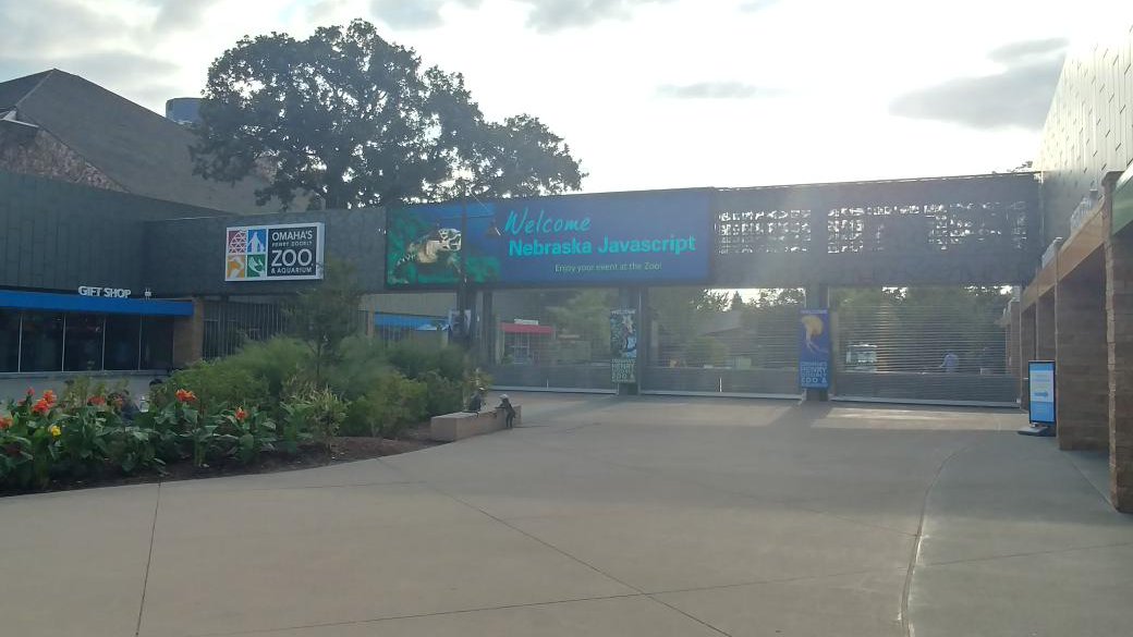 the entrance of Omaha's Henry Doorly Zoo & Aquarium, with a banner that says 'Welcome Nebraska Javascript'