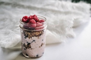 Glass jar with oats, fruit and yoghurt