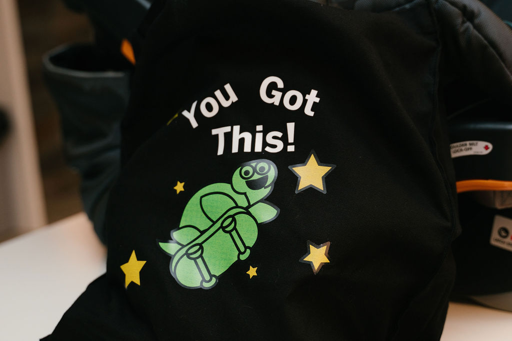 bag with 'You Got This' and a skateboarding turtle printed on it